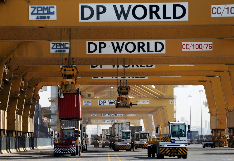 Terminal tractors line up to load containers into a cargo ship at DP World's Terminal 2 at Jebel Ali Port in Dubai, United Arab Emirates. Picture: HAMAD MOHAMMED/REUTERS