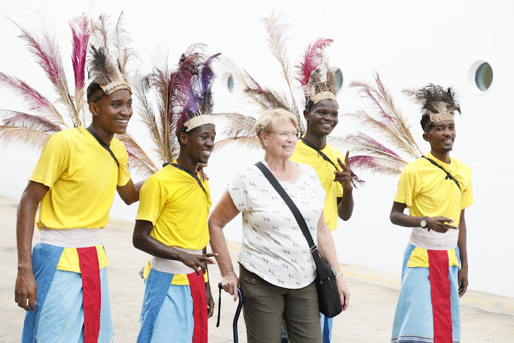 Passenger from the Luxury cruise liner Norwegian Dawn being entertained by local dancers on January 14, 2024