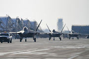 US F-22  fighter jets move after landing at the Kunsan airbase during the joint air drills on December 20, 2022 in Kunsan.