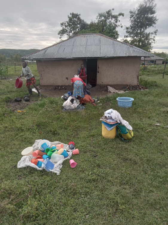 Some members of a family are packing to leave atheir house after floods displace them in Homa Bay on November 6,2023