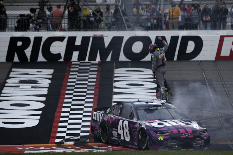 Alex Bowman celebrates his victory at the Toyota Owners 400.