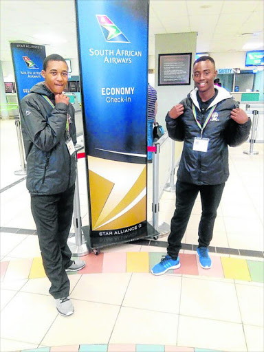 CHAMPS: Guju Kai Karate Queenstown Karaketa Asabela Xinindlu (left) and Ayabonga Shasha (right) at the East London airport before they left for the international championships held in Canada Picture: MFUNDO PILISO