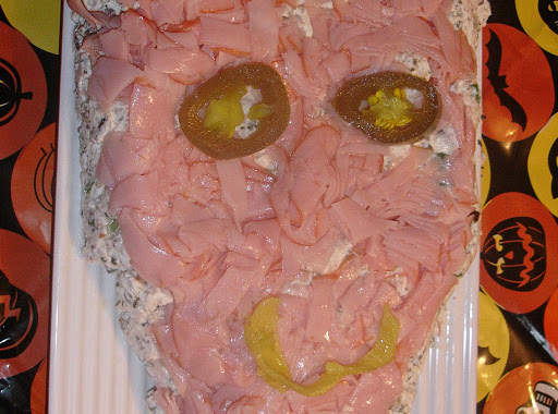 Instead of wrapping the roll with the ham; I decided to tear it into pieces and make a mummy for halloween