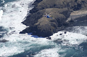 A helicopter searches for missing people aboard the missing tour boat 