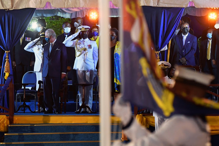 Britain's Prince Charles looks away as the British Royal Standard flag is lowered at the Presidential Inauguration Ceremony to mark the birth of a new republic in Barbados, Bridgetown, Barbados, on November 29, 2021.