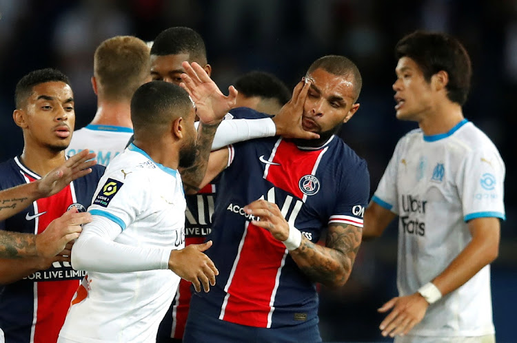 Olympique de Marseille's Jordan Amavi clashes with Paris St Germain's Layvin Kurzawa in their Ligue 1 match at Parc des Princes, Paris on September 13, 2020