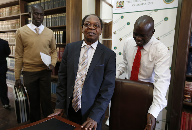 Justice Erastus Githinji takes his seat for the interview of Position of Supreme Court Judge before the JSC at the Supreme court building on October 11, 2016.