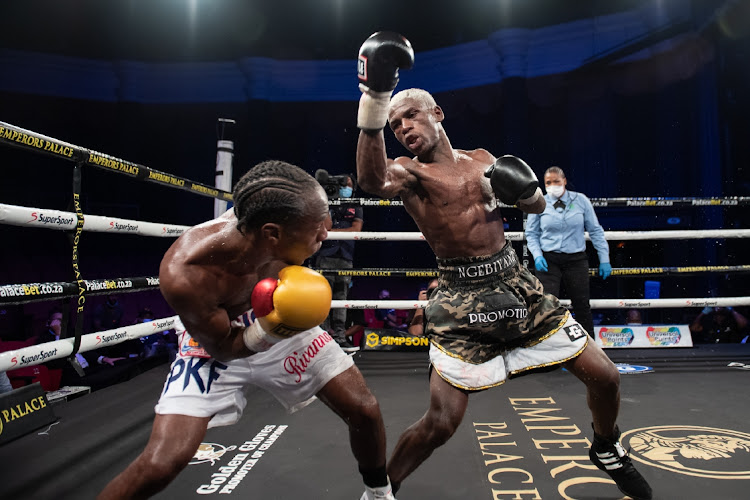 Ricardo Malajika (white trunks) and Sabelo Ngebinyana (army trunks) in action. Ngebinyana has been in Namibia for more than his fight there, waiting to be paid.