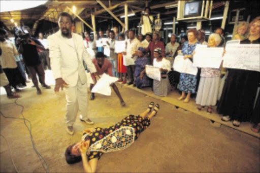 Pastor TB Joshua treats a South African devotee at the Synagogue Church Of All Nations in Lagos, Nigeria. Joshua claims to cure people of all afflictions, including HIV/Aids. Zimbabwean politicians have been flocking to Lagos, Nigeria for healing sessions