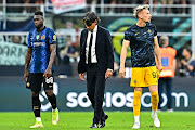 : Head coach Simone Inzaghi of Inter (C) leaves the pitch together with Felipe Caicedo (L) and Ionut Radu of Inter after the Serie A match between FC Internazionale and UC Sampdoria at Stadio Giuseppe Meazza on May 22, 2022 in Milan, Italy. 