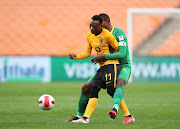 Khama Billiat is challenged by Vusi Sibiya of Baroka FC in Kaizer Chiefs' 2-1 DStv Premiership win at FNB Stadium on August 25, 2021.