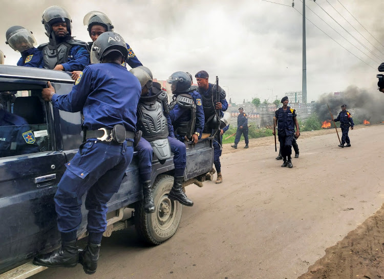 Riot police officers amass at a street to block a protest by the opposition who are calling for a re-run of last week's national election, in Kinshasa, DRC, on December 27 2023.