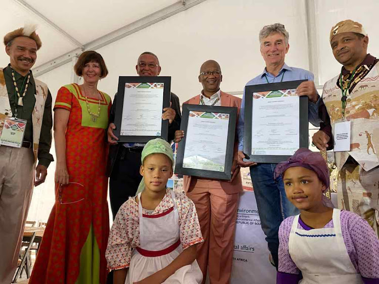 IT'S A DEAL: Celebrating the signing of a rooibos plant benefit-sharing deal are, back from left, Khoi-San community representative Barend Salomo, environment minister Barbara Creecy, Khoi-San Council chair Cecil Le Fleur, San Council chair Collin Louw, SA Rooibos Council chair Martin Bergh and Stanley Peterson