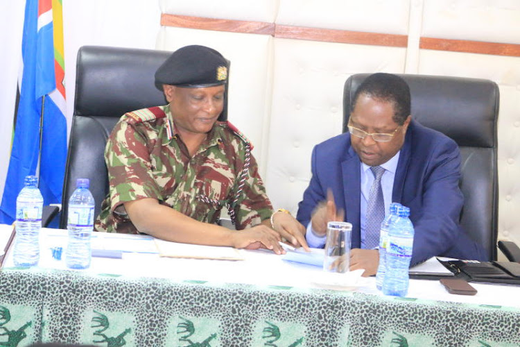 Embu county commissioner Abdulahi Galgalo with Embu Governor Martin Wambora during a past function