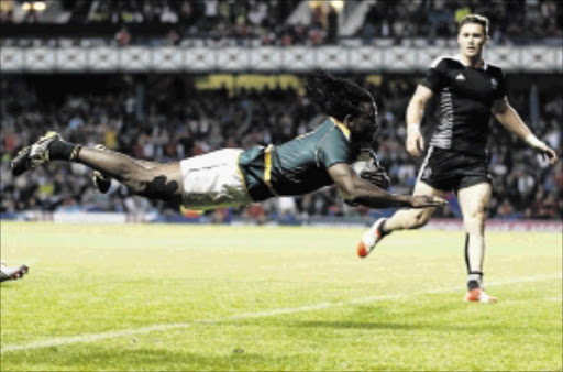 TRY MACHINE: Seabelo Senatla of SA dives to score a try against New Zealand during the gold medal match of the rugby sevensPhoto: Russell Cheyne/Reuters