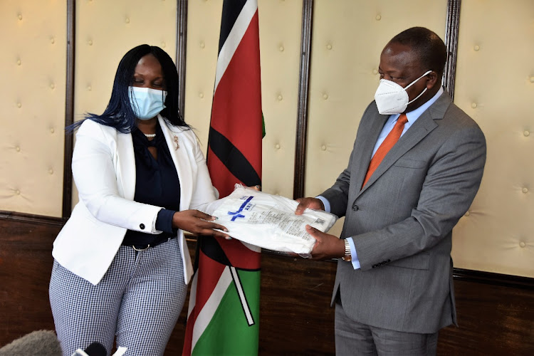 Health CS Mutahi Kagwe speaks after receiving a donation of PPEs worth Sh2.3 million from Multi Choice Kenya Managing Director Nancy Matimu at Afya House on April 21, 2021