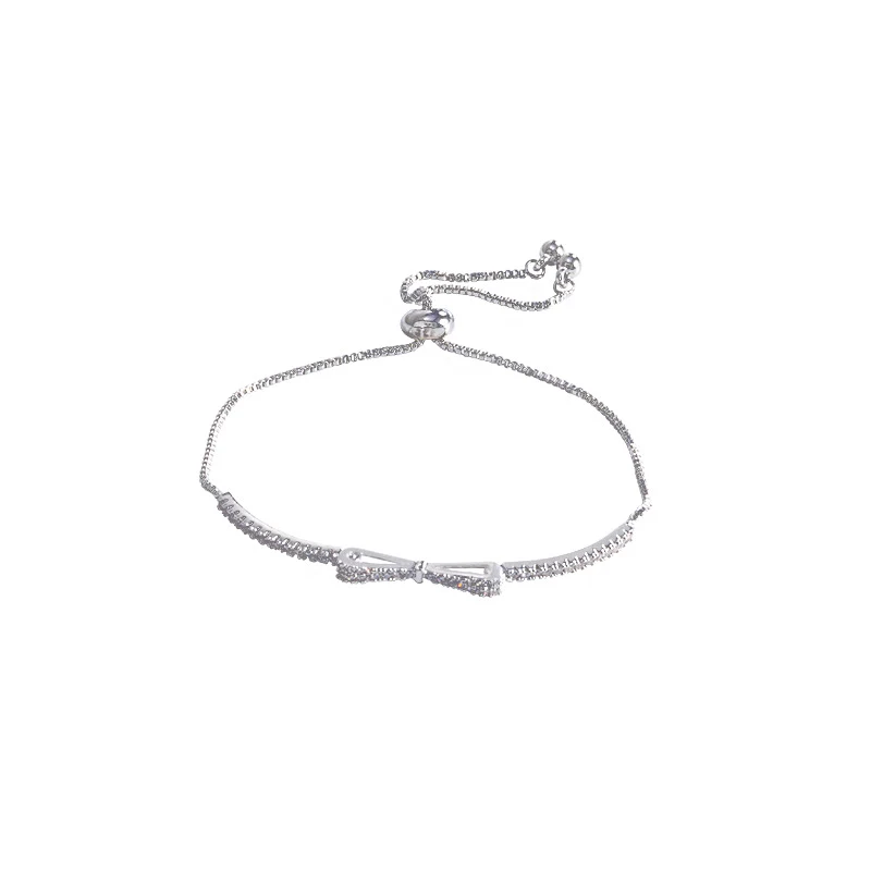 Pulseira de laço feminina com micro zircônias incrustadas. Design requintado e delicado, um acessório perfeito para mulheres.