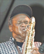 The Germiston Lake Jazz show by various  top artist.  Vetaran jazz maestro Winston Mankunku Ngozi displaying his old talent in a show attended by hundreds. PHOTO:  MBUZENI ZULU. 01/06/1980. © Sowetan.