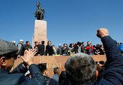 People attend a rally following post-election protests during which opposition groups took control of most of the government's apparatus, in Bishkek, Kyrgyzstan, October 7, 2020.  