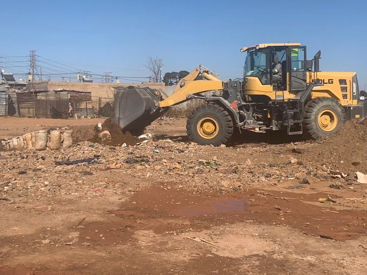 Police flatten a zama-zama camp in Roodepoort.