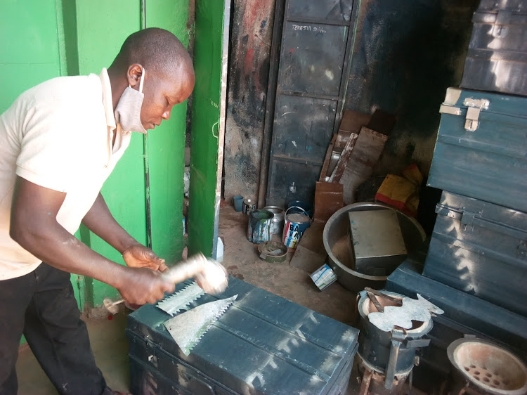 William Buradi at his workshop where he makes School boxes