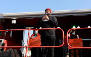 EFF deputy president Floyd Shivambu addresses party supporters outside the US consulate in Sandton. 