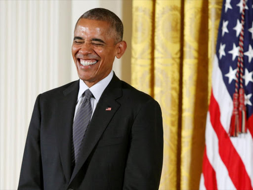 US President Barack Obama laughs while awarding the 2015 National Medal of Arts and 2015 National Humanities Medals at the White House in Washington, US, September 22, 2016. / REUTERS