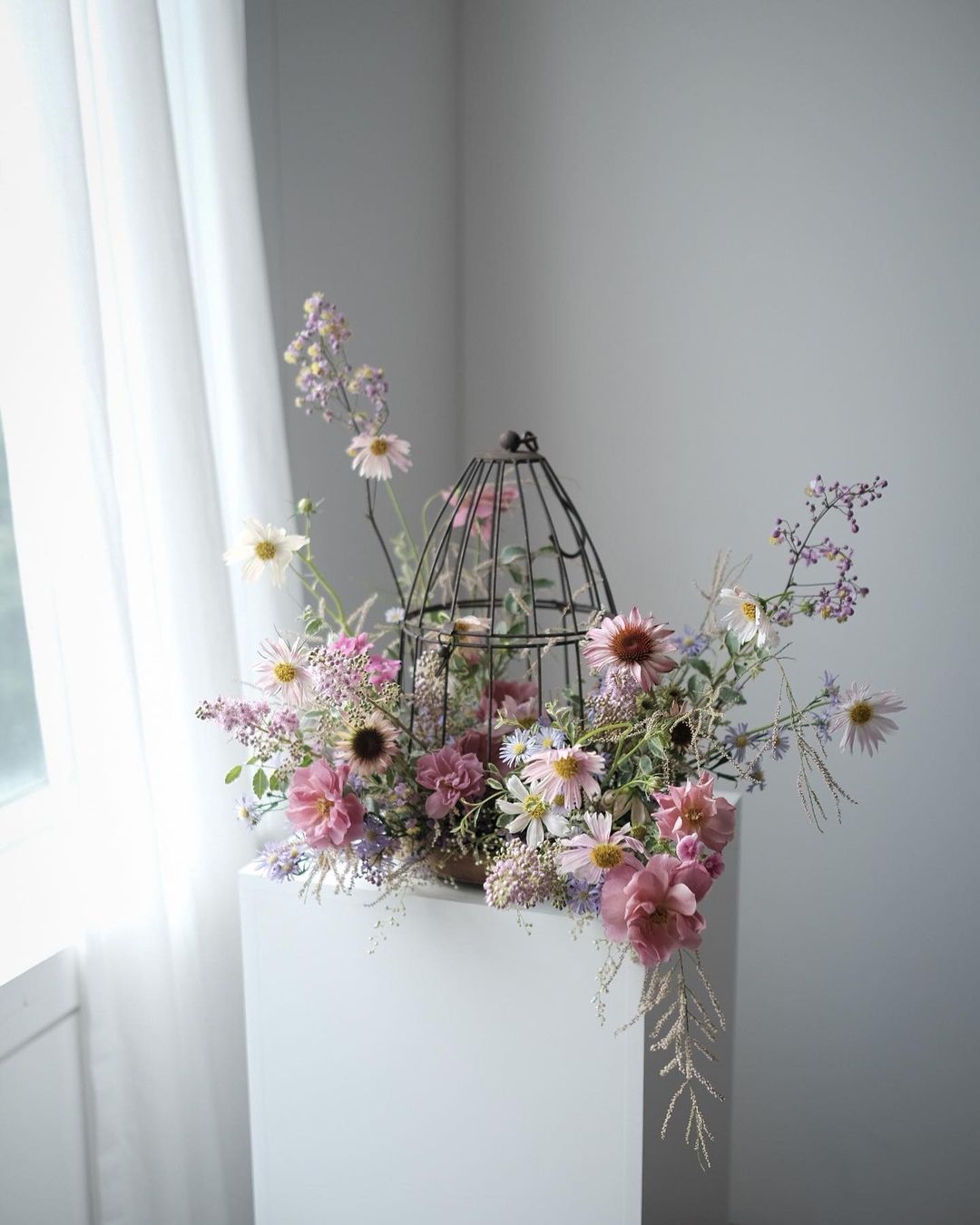 A Birdcage With Flowers