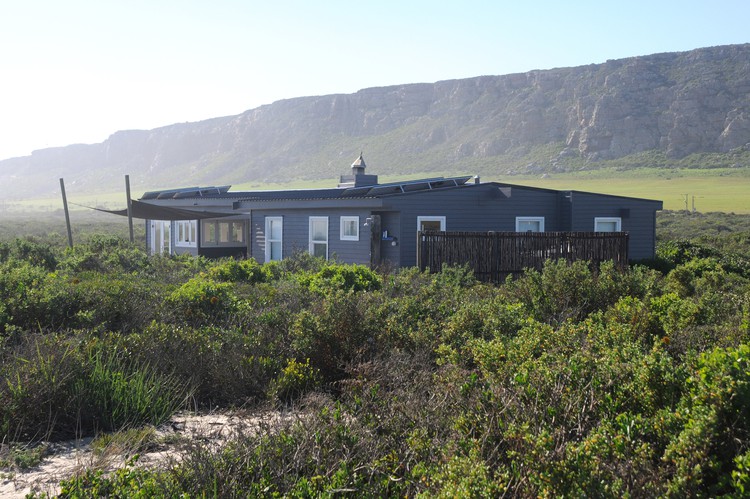 The first beach house built illegally in 2012 by Cape Town businessman Parkin Emslie on the coastal strip near Elands Bay. It was destroyed by fire in 2018.