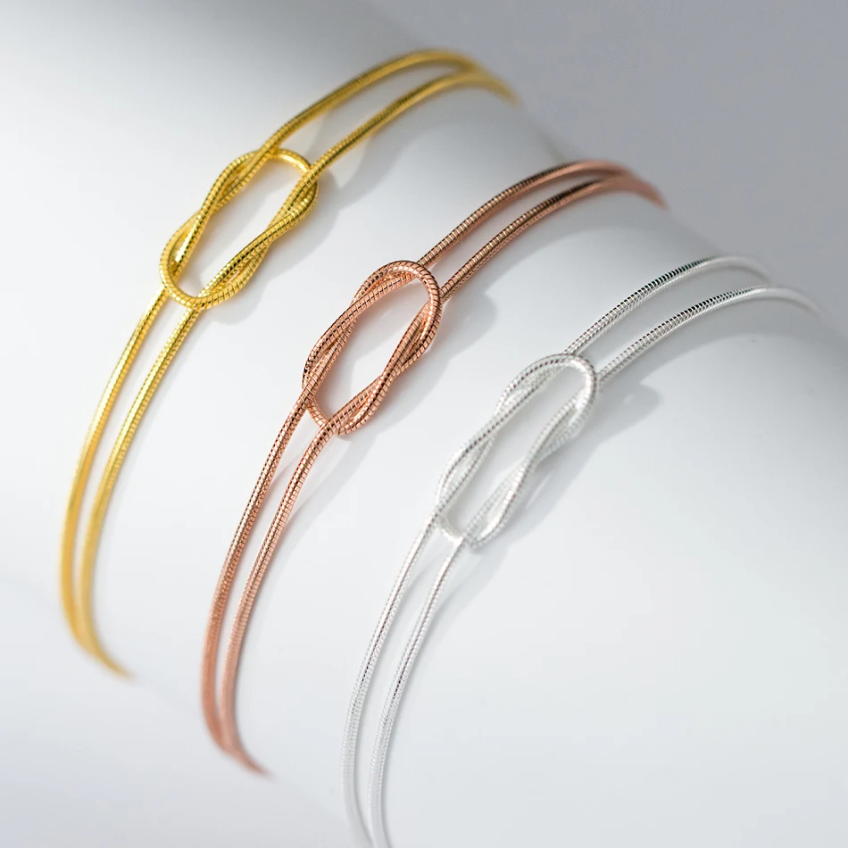 Pulseira com corrente de osso de cobra e nó de vento de prata esterlina S925 Ins, design moderno e elegante, perfeita para adicionar charme ao seu visual.