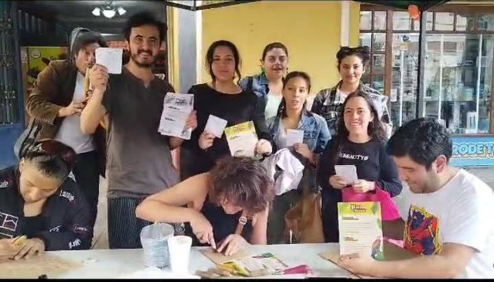 Rebels smile and hold ballot papers as they vote in the referendum