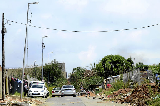 Some residents of Lombardy West in northern Johannesburg have been without electricity for weeks after shacks mushroomed in their area. /Mduduzi Ndzingi