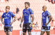 The Emirates Lions captain Warren Whiteley is flanked by Lionel Mapoe and Jacques Van Rooyen during the Super Rugby match againt the Cell C Sharks at Emirates Airline Park on February 17, 2018 in Johannesburg, South Africa. 