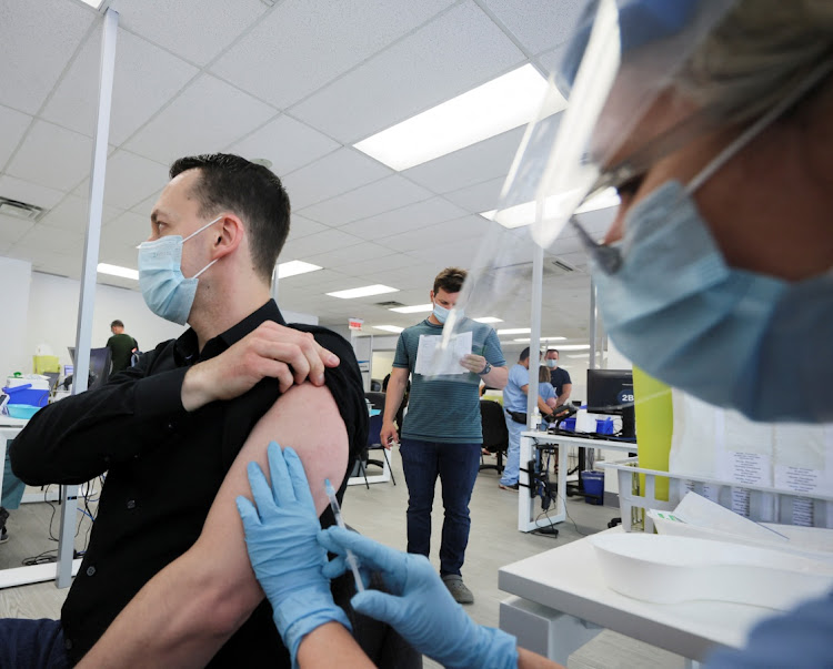 A man is vaccinated at a monkeypox vaccination clinic run by CIUSSS public health authorities in Montreal, Quebec, Canada, in this June 6 2022 file photo. REUTERS/CHRISTINNE MUSCHI