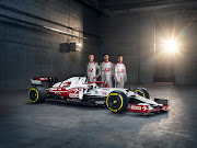 From left to right: Robert Kubica, Antonio Giovinazzi and  Kimi Räikkönen stand behind the new Alfa Romeo C41.