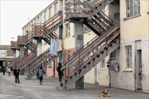 THE TIME TO ACT IS NOW: Children walk past Soetwater Flats in Hanover Park. Residents in the area want a state of emergency declared to try and curb gang violence. PHOTO: SHELLEY CHRISTIANS