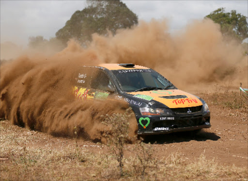 DUSTY AFFAIR: Carl ‘Flash’ Tundo navigated by Tim Jessop driving Mitsubishi Evo 9 in a past rally