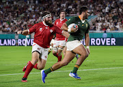 South Africa's Damian de Allende runs in to score a try against Canada during a Pool B Rugby World Cup match. 