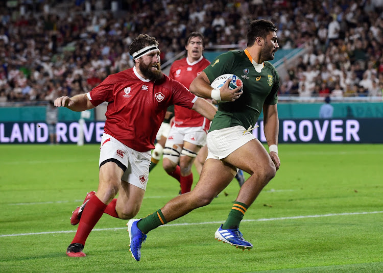 South Africa's Damian de Allende runs in to score a try against Canada during a Pool B Rugby World Cup match.