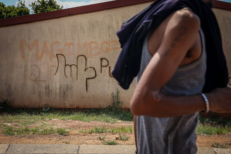 A gang sign relating to the Varados is seen on a wall in Westbury extension 3.