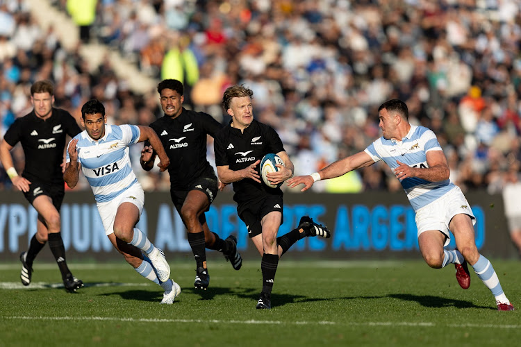 Damian McKenzie of New Zealand runs with the ball during their Rugby Championship match against Argentina at Estadio Malvinas Argentinas in Mendoza, Argentina on July 8 2023.