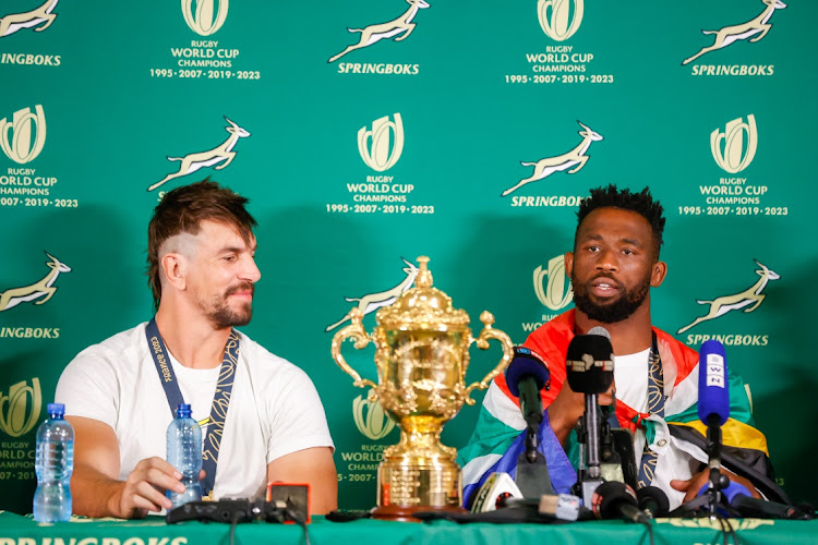 Eben Etzebeth and captain Siya Kolisi during a press briefing at OR Tambo international Airport after arriving from winning the Rugby World Cup in France. South Africans flocked to the airport to celebrate the team's victory. Photo: Thulani Mbele