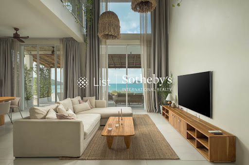 Spacious living room with sectional sofa and sea view - Buy this luxury villa in Ko Pha-ngan, 5 bedrooms