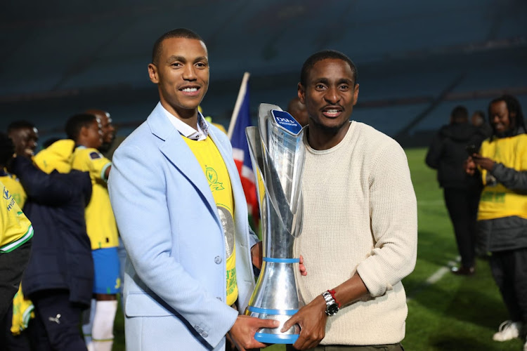 Mamelodi Sundowns chairman Tlhopie Motsepe and coach Rulani Mokwena celebrate with the DStv Premiership trophy after their 1-1 draw against Maritzburg United at Loftus Versfeld Stadium in Pretoria.