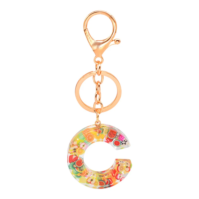 Porte-clés résine 26 lettres anglaises, pendentif fruit, série tendance Europe et Amérique. Cadeau époxy original et personnalisé pour vos clés.