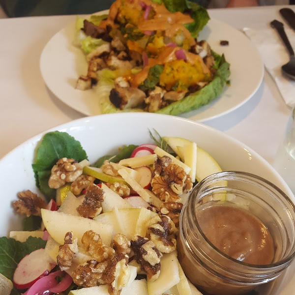 pear salad in front, tacos in back