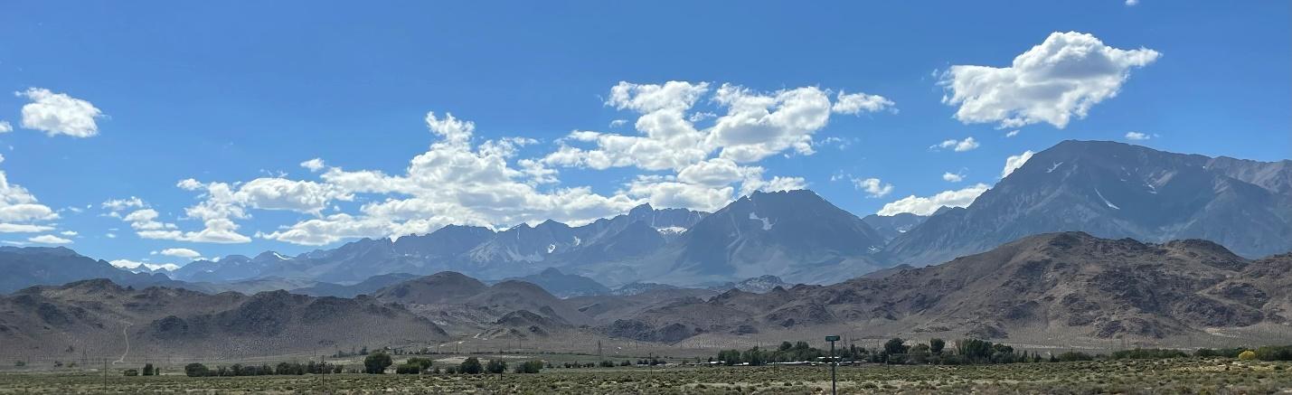 A landscape with mountains and clouds