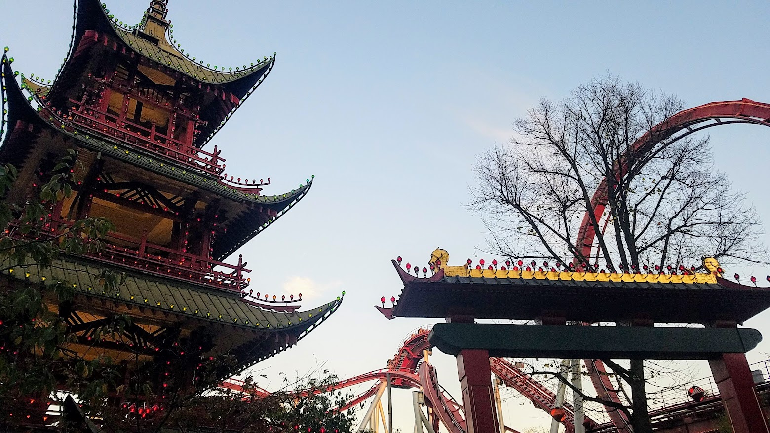 The Japanese pagoda and The Demon roller coaster / Visiting Tivoli Amusement park during Halloween decoration time, October 2018