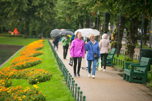 Bergen-park-pedestrians-1.jpg - Buildings rise above the lake Lille Lungegardsvannet in downtown Bergen, Norway. 