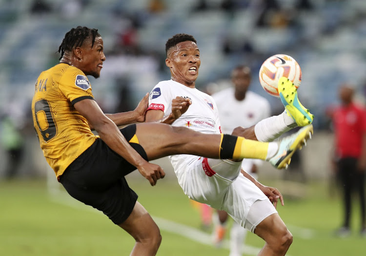 Elmo Kambindu of Chippa United is challenged by Siyabonga Ngezana of Kaizer Chiefs during the DStv Premiership match at Moses Mabhida Stadium in Durban on October 15 2022.